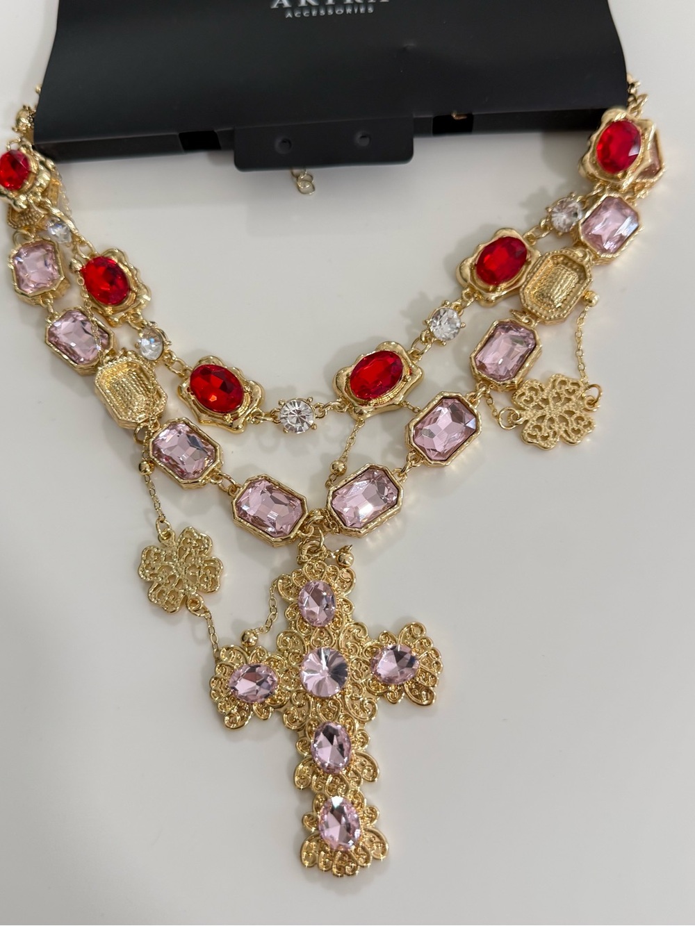 AKIRA Gold-Tone Cross Necklace with Red and Light Pink Stones